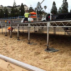 Megadeck setting up a beach stage